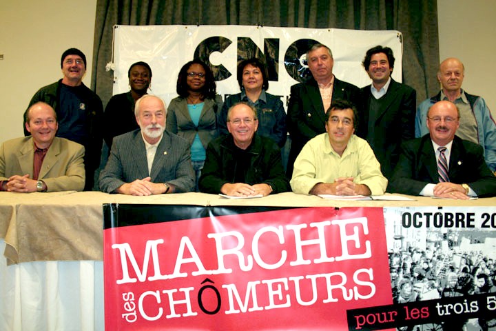 Le comité national d'appui au chômeurs et chômeuses. Au centre, le secrétaire général de la FTQ, René Roy